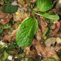 Beef Laap · Chopped grilled beef mixed with sliced purple onion, green onion, cilantro, mint, Thai chili...