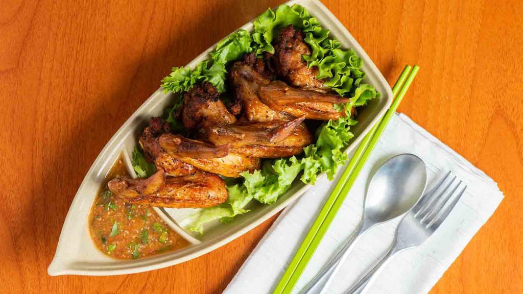 Fried Wings (4) · Marinated in special seasoning. Served with house chili sauce.