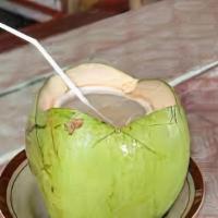 Coconut Juice · Fresh coconut juice with coconut meat over ice.