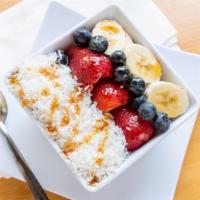 Coconut Bowl · A supper healthy breakfast bowl has Organic Acai fruit as a base and topped with Granola, Ba...