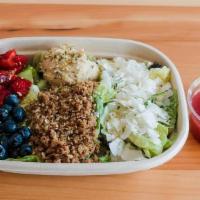 Island Berry Grain Bowl · Crafted with Mixed Greens & Romaine, Blueberry, Strawberry, Coconut Chips, Hummus, Red & Whi...
