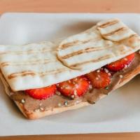Almond Berry Flatbread Sandwich · Flatbread Sandwich with Almond butter, Strawberry, Honey, and Hemp Seeds.