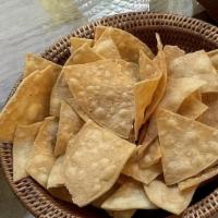 Totopos Caseros / Housemade Tortilla Chips · Vegan, gluten free.