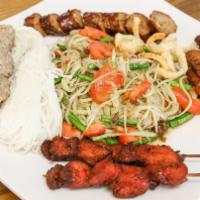 The S.E.A. Platter · Lao pork sausage (2), beef (2), chicken (2), beef meatball (2) - skewers and papaya salad, t...