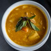 Cambodian Curry · 24 oz of Boneless chicken, potato & carrot simmered in red curry & coconut milk, served with...