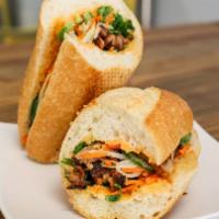 Sea Sandwich · Baguette layered (spicy) mayo spread with meat of your choice, pickled papaya and carrot, cu...