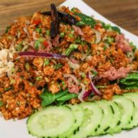 Nam Khao · Crispy rice tossed with nam sausage, cilantro, green and red onion, and kaffir lime leaves; ...