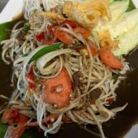 Papaya Salad · Shredded green papaya tossed in mortar with fermented fish sauce, crab paste, shrimp pasted,...