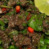 Beef Laab (Cooked) · Sliced beef tossed with fermented fish sauce, lime juice, mint, cilantro, green onion and re...