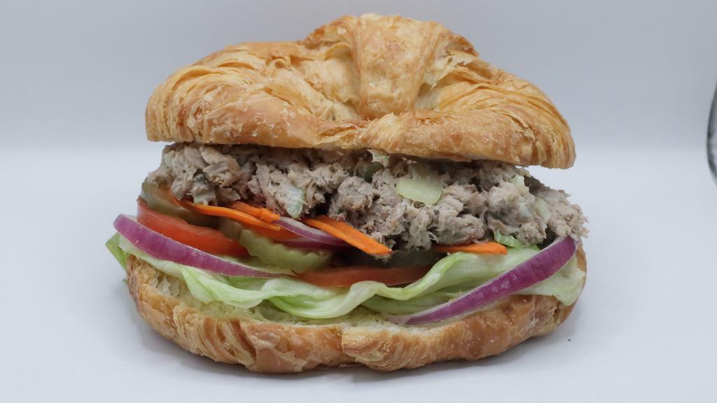 Tuna Sandwich · lunch sandwich comes  with lettuce, pickled cucumber, carrot and onion.