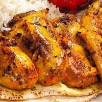10 Skewers Of Cornish Game Hen · Served with Rice, Pita Bread and Grilled Tomatoes