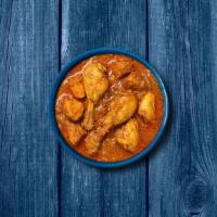 Capital Chicken Curry · Bone in/ boneless chicken pieces simmered in brown onion and tomato curry, seasoned with fre...