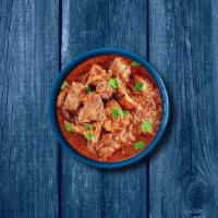Capital Lamb Curry · Tender chunks of lamb simmered in a brown onion and tomato curry, seasoned with fresh herbs ...