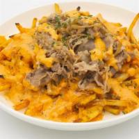 Shaken House Fries · Skinny fries topped with shaken beef belly, garlic, caramelized onions, sharp cheddar cheese...
