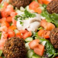 Falafel Foreva · 6 pieces of falafels are served on a bed of house salad, with a side of tahini, and grilled ...
