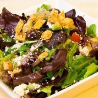 Krispy Green Salad · Mixed greens, cucumber, tomato, olives, red onion, feta, house made pita chips, and lemon dr...