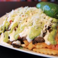 Guapo Fries · Choice of meat, cheddar cheese sauce, pico de gallo, sour cream, guacamole, jalapeños, and s...