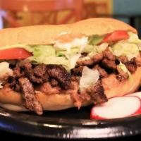 Torta · Choice of meat, mayonnaise, refried beans, lettuce, tomato, salsa, and guacamole.