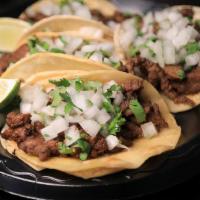 Tacos · Choice of meat, onions, cilantro, and salsa.
