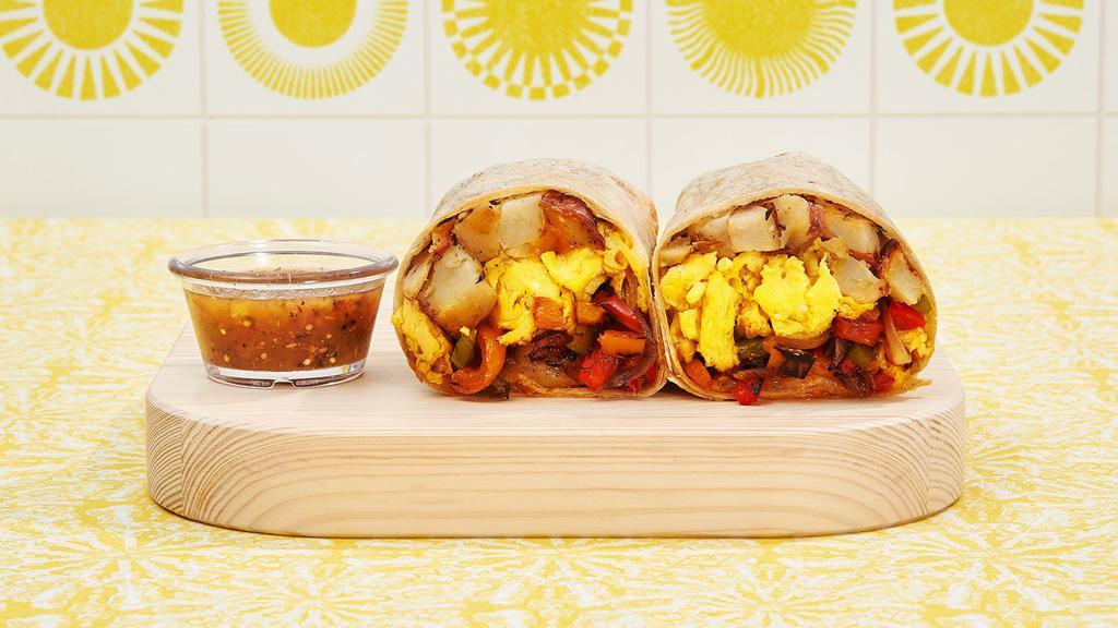 Fajita Veggie Breakfast Burrito · Two scrambled eggs, sauteed peppers and onions, breakfast potatoes, and melted cheese wrapped in a fresh flour tortilla.
