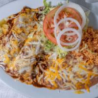 Enchilada Dinner · Mole sauce enchilada with chicken or beef or cheese. Served with rice and beans.