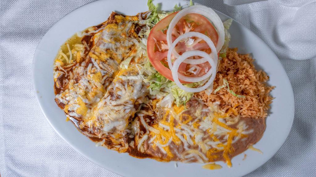 Enchilada Plate · Two enchiladas your choice of cheese or chicken with a side of lettuce, tomatoes and sour cream.