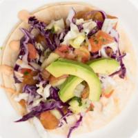 Tacos - Fish · Fried tilapia fish topped with fresh homemade dressing, mixed cabbage, avocado and fresh pic...