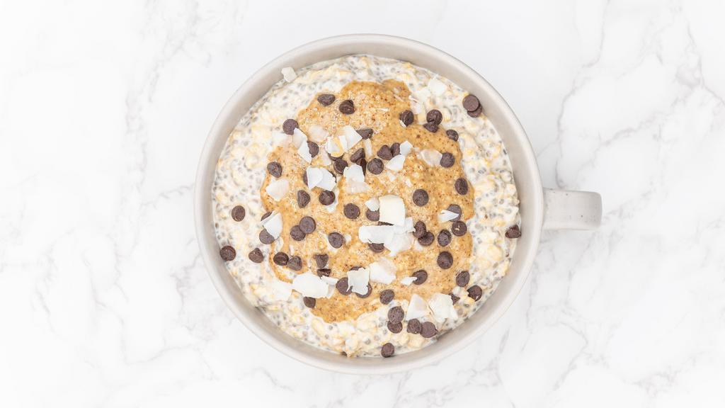 Almond Chocolate (10 Oz Jar) · Dairy free, vegan, gluten free. GMO-free. Almond butter, semi-sweet chocolate chips, and unsweetened coconut over a blend of organic rolled oats and chia seeds soaked overnight in cashew milk.