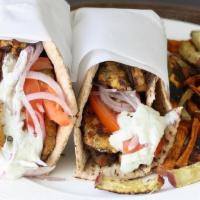 Gyro Sandwich · Thinly sliced grilled gyro meat with lettuce, tomatoes, onions, topped with tzatziki sauce r...
