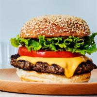 Cheeseburger · Two USDA beef patties grilled and placed in a sesame bun with lettuce, tomatoes, pickles, on...