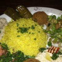 Vegetarian Plate · Combination of different Mediterranean dishes and salads. Hunujs, baba ghanouj, falafel, stu...