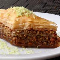 Baklava · Pastry stuffed with minced walnuts topped with our special sweet syrup