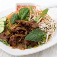 Veggie House Salad · Marinated tender soy beef, stir with curry sauce. comes with fresh mint leaves, cucumber, on...