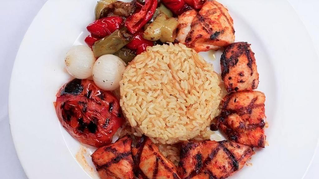 Chicken Kebob · grilled marinated chicken thigh meat served with rice pilaf, bell peppers, grilled tomato, peal onions. tzatziki, hummus & pita bread on the side.