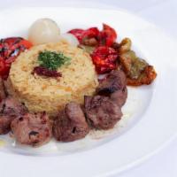 Lamb Souvlaki · grilled marinated lamb with rice pilaf, bell peppers, grilled tomato, pearl onions. tzatziki...