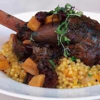 Lamb Shank · slow cooked braised lamb shank with garlic mashed potatoes and dried fruit balsamic reduction.