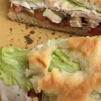 Panino Caprese · Cold sandwich. Fresh imported buffalo mozzarella, sliced tomato, and lettuce with sundried t...