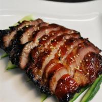 Bbq Pork · Slices of honey glazed pork roasted in our Chinese barbecue oven, served with pickled cucumb...