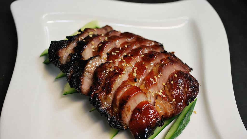 Bbq Pork · Slices of honey glazed pork roasted in our Chinese barbecue oven, served with pickled cucumbers