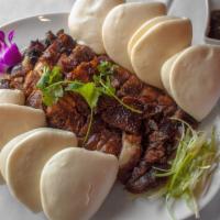 Peking Duck Whole · Boneless slices, roasted and served with steamed buns, scallions and Hoisin sauce