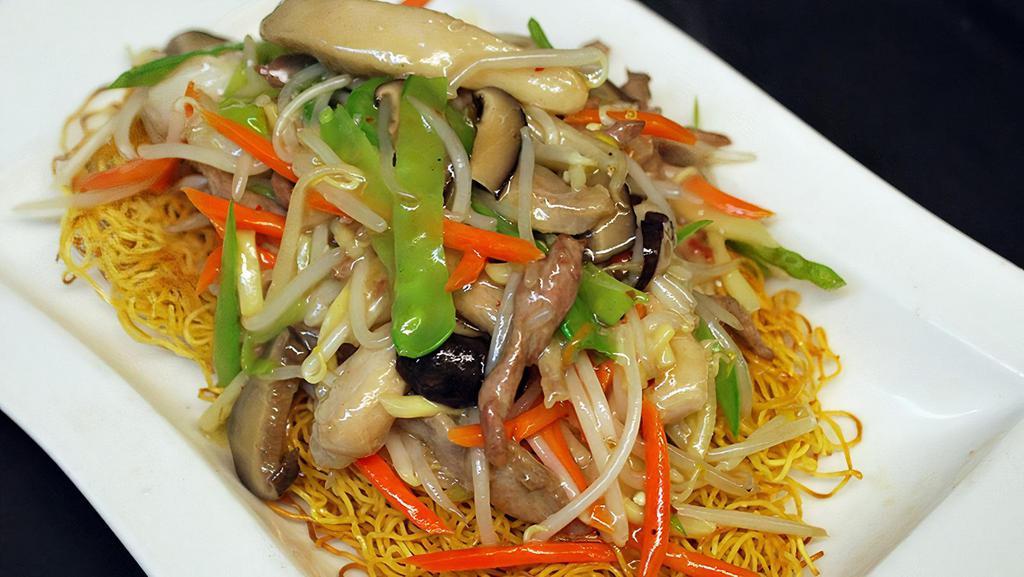 Hk Sum-See Chow Mein · Pork, chicken, shrimp, bean sprouts, snow peas, carrots and mushrooms served over thin pan-fried noodles