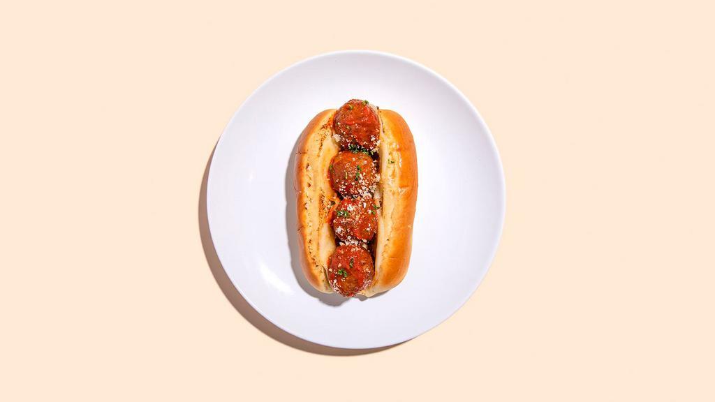 Meatball Parmesan Sandwich · Three meatballs covered in Ma's Sunday Sauce and melted mozzarella on a toasted Italian hero.
