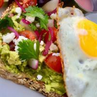 Avocado Toast · Avocado mash topped with radish, cherry tomato, pickled onion, olive oil, and cilantro on a ...