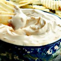 French Onion Dip With Hot Potato Chips  · A beautiful bowl of creamy caramelized onion dip with warm homemade crispy potato chips.