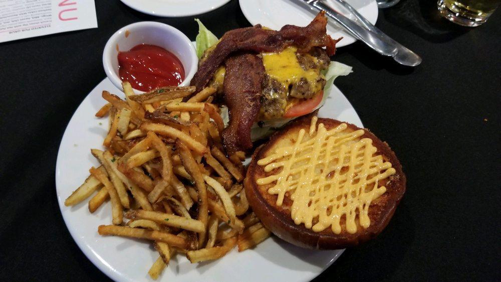 Krush Burger  · All beef patty, bacon bits, pimento pickle relish, cheddar cheese, tomato, white onion, sweet savory sauce, on a brioche bun griddled and pressed to perfection.