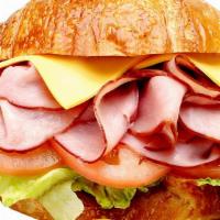 Ham & Cheese Croissant Sandwich · Includes cheese (your choice), lettuce, tomato, and mayonnaise. Dill pickle spear, pepperonc...