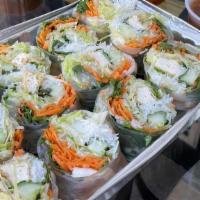 Thai Spring Rolls · Fresh rice paper wrapped with shrimp, vegetables, tofu, glass noodles, and basil, served wit...