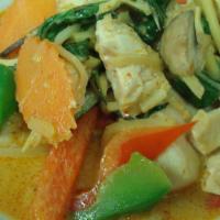 Red Curry · Red curry paste with bamboo shoot, bell peppers, and basil.