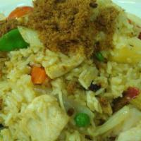 Pineapple Fried Rice · Fried rice with pineapple, egg, raisin, shrimp, and chicken in yellow curry powder and cashe...