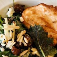 Seared Salmon Baby Kale Salad · Rainbow quinoa, Fuji apples, dates, goat cheese crumbles, slivered almonds and honey champag...